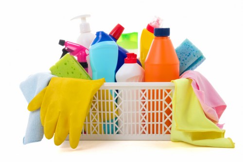 Cleaner working on upper-level windows in Holland Park with suitable access equipment