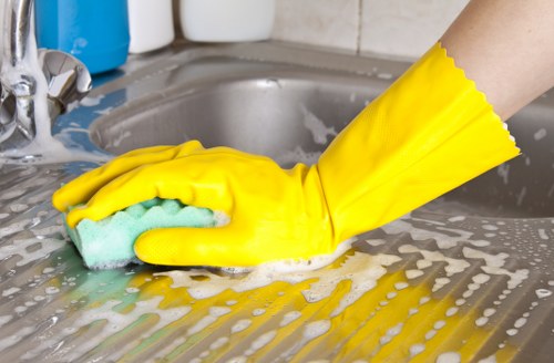 Office cleaning tasks including desks, floors, and communal areas in a Holland Park workspace